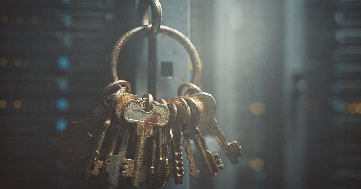 A ring of old metal keys hanging on a hook in a dim server room with blurred status lights behind